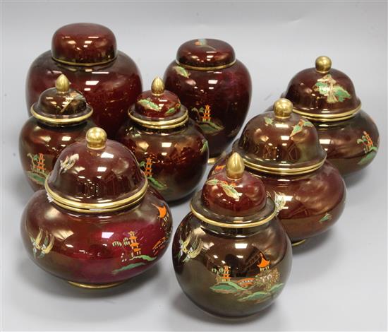 A pair of Carlton Ware Rouge Royale Pagoda ginger jars and covers, five similar small jars and covers and a plain example (8)